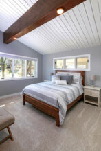 master bedroom with wood tongue and groove ceiling