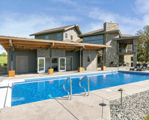 swimming pool and rustic pool house