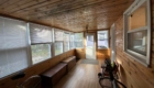 sunroom with wood walls