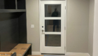white exterior door with 3 panels of glass